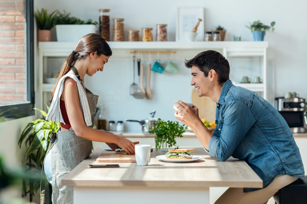 young couple having breakfast after roof replacement