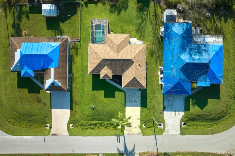 arial view of residential homes to show how to tarp a roof after damage