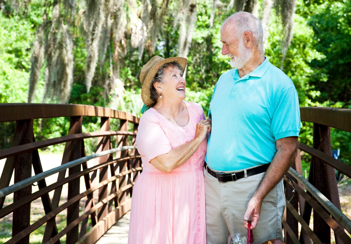 retired florida seniors hiking, laughing, talking together