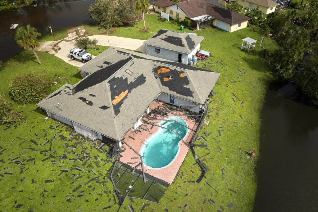 arial view of roof damage after hurricane and before repairs
