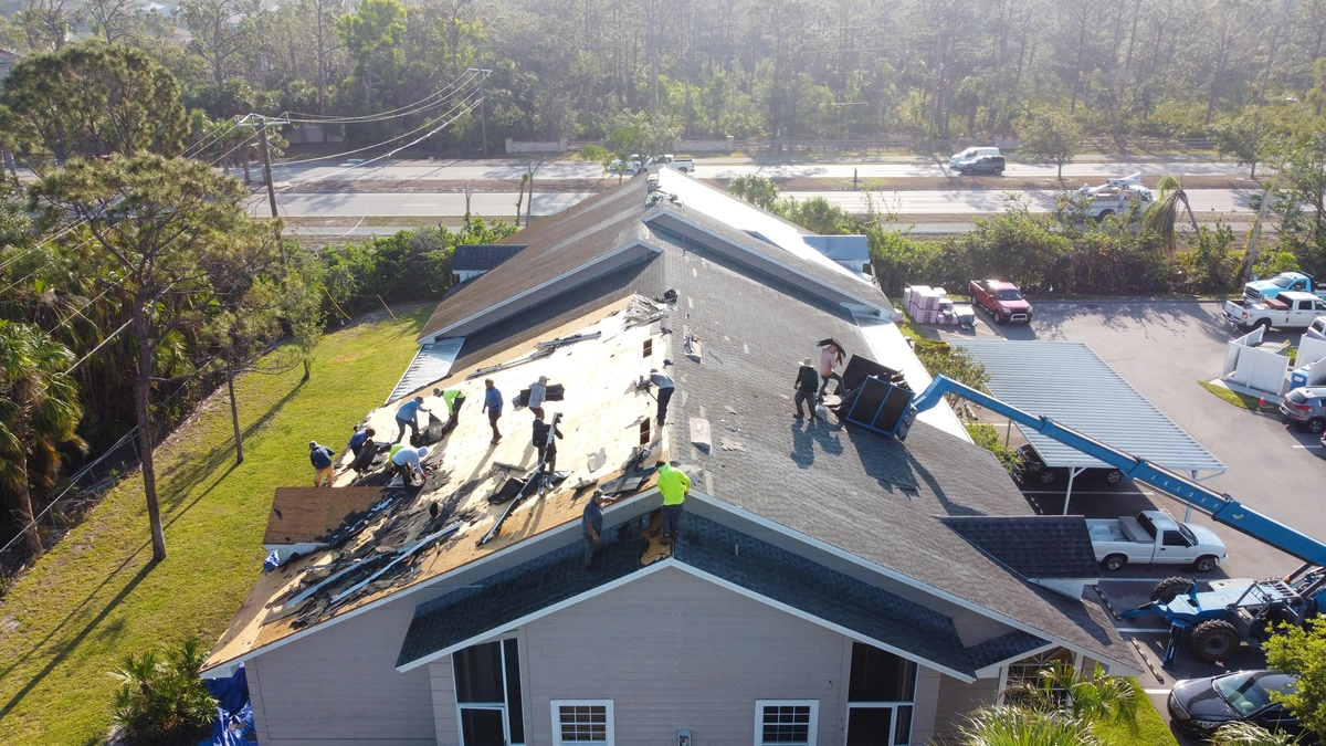 hurricane roof damage is repaired by roofing contractors