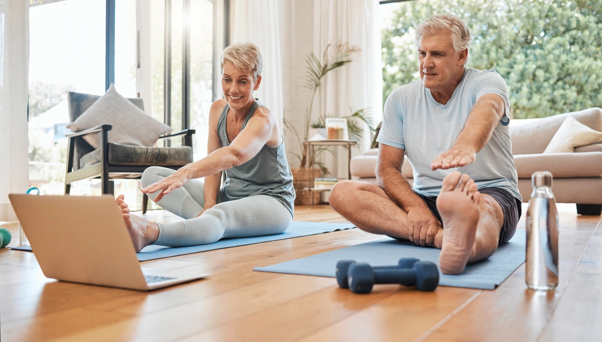 retired couple in Florida doing yoga together inside their bright living room with a new roof