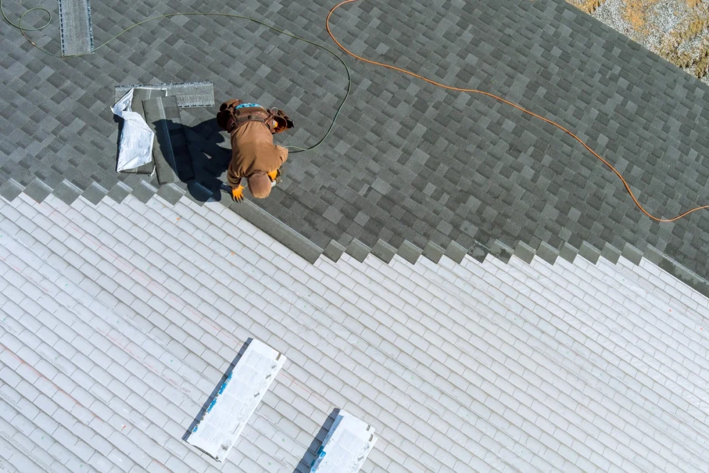 arial view of contractor replacing roof after sever wind damage blew off shingles