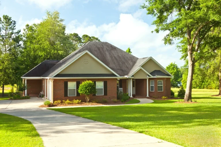 classic house with asphalt shingle roof and yard