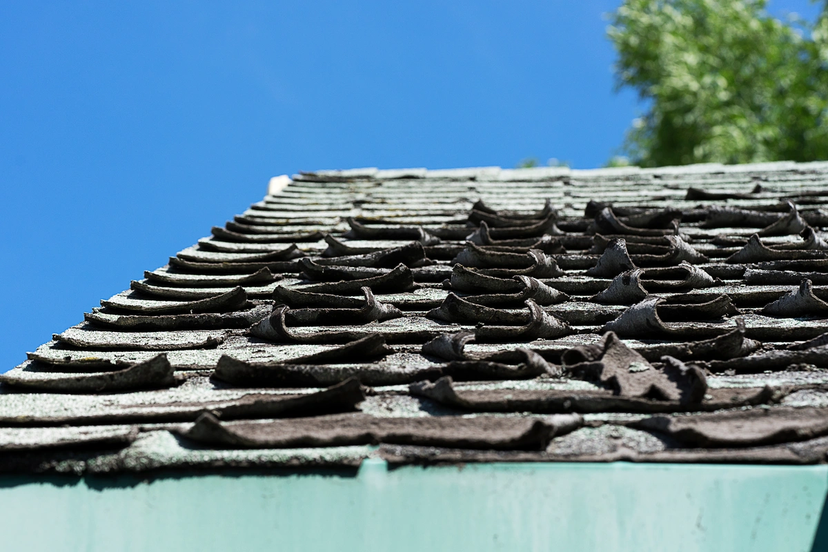 house roofing shingles curled and damaged